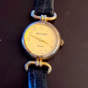 Vintage slimline black leather & gold tone watch. Needs battery. Pierre Cardin.